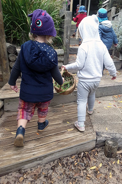 children holding vegetables